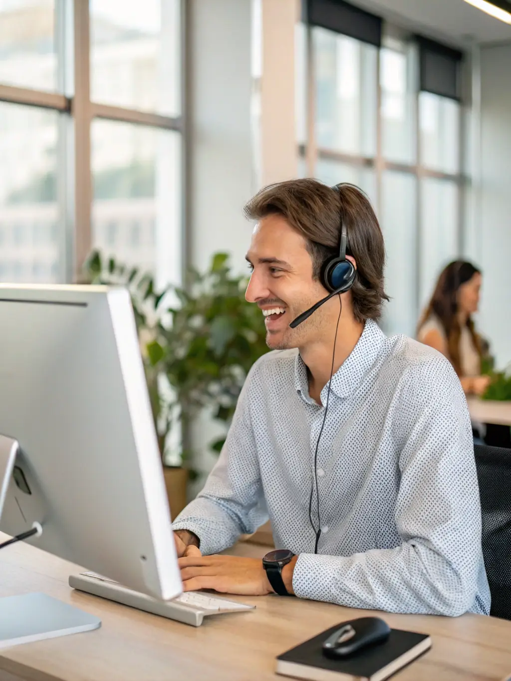 A professional support agent assisting a customer via video call, with technical diagrams and charging station schematics visible on a screen.